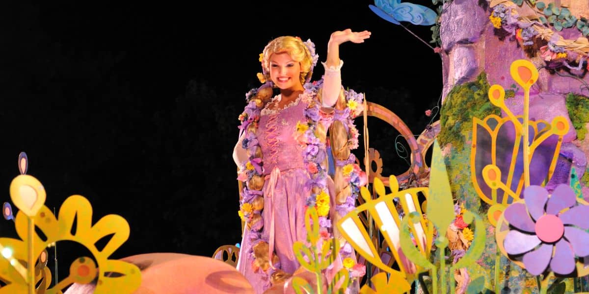 Rapunzel waves during a parade