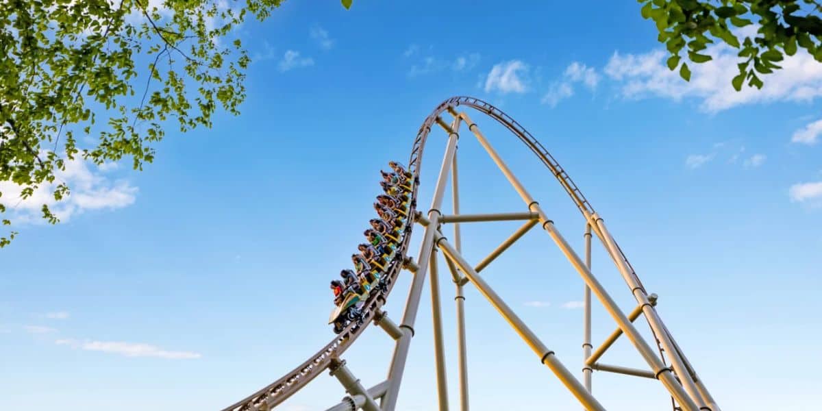 A roller coaster with a group of people riding it at Busch Gardens Williamsburg.