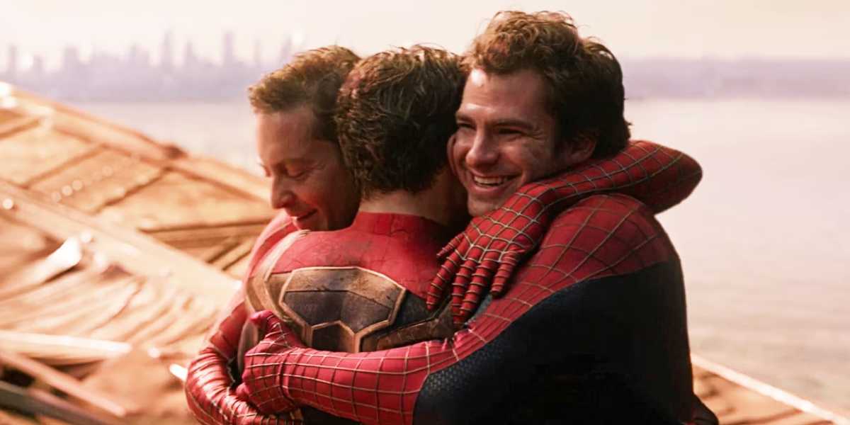 Andrew Garfield, Tobey Maguire and Tom Holland as Peter Parker hugging