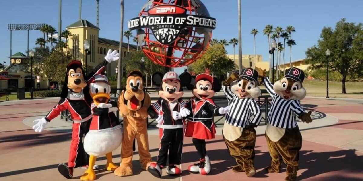 Goofy, Donald, Pluto, Mickey, Minnie, Chip and Dale in front of the ESPN Wide World of Sports Complex