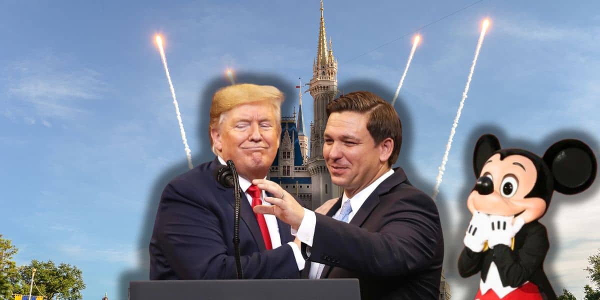 Donald Trump and Ron DeSantis in suits, one with a red tie and the other a blue tie, stand together smiling with fireworks and a castle in the background. On the right, Mickey Mouse from Disney poses with his hands on his cheeks.