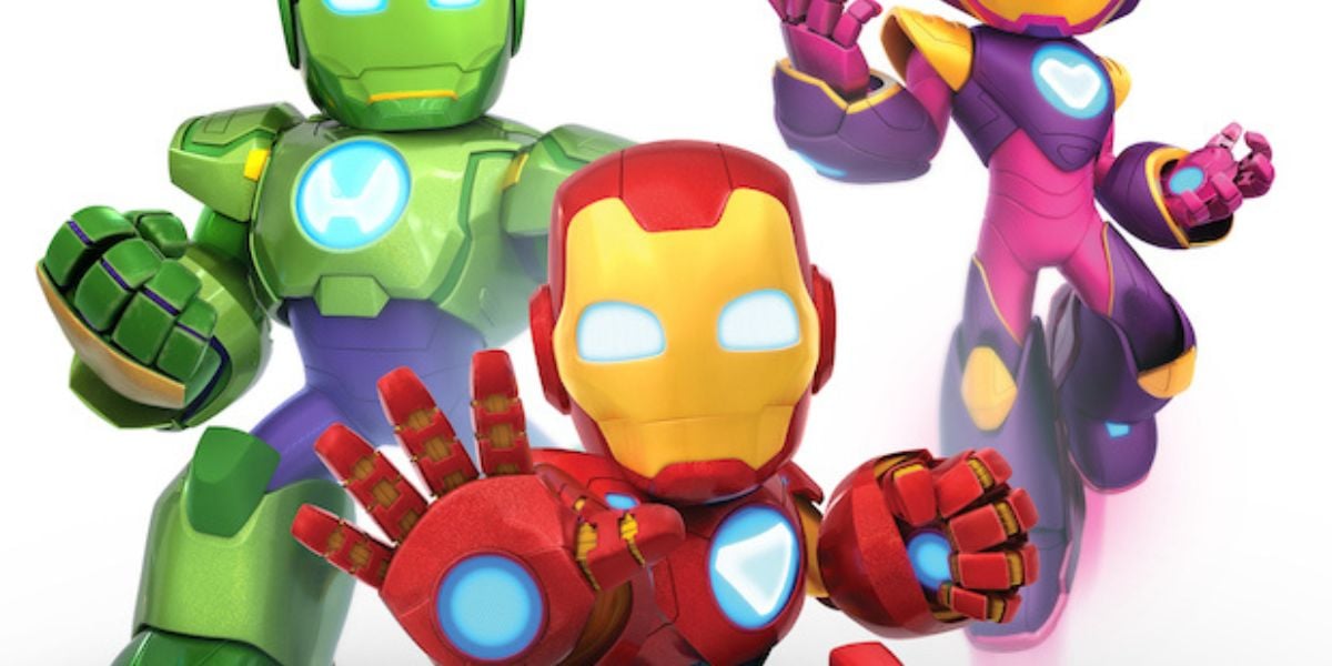 Three cartoon robots, resembling Iron Man with their glowing eyes and sleek armor in red, green, and pink. Each strikes a dynamic pose against a plain white background, emphasizing their vibrant colors—one even extends its hand energetically forward like a Marvel Production hero.