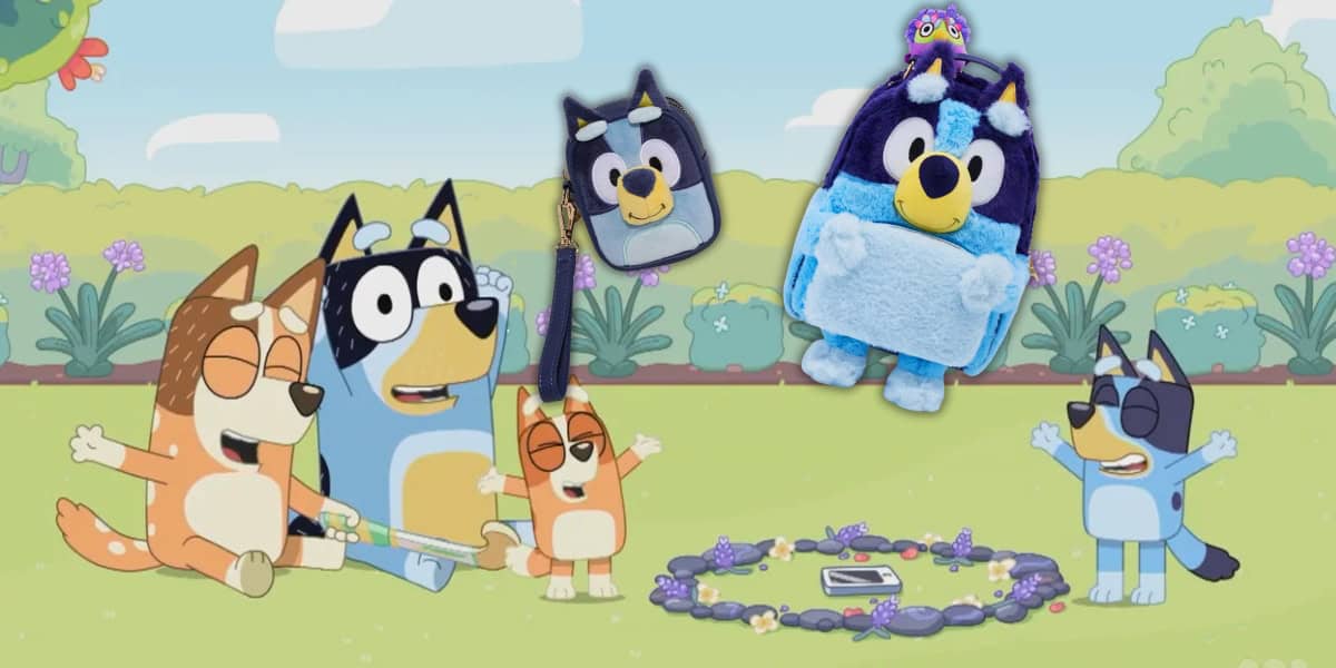 Cartoon dogs sit in a grassy area surrounded by flowers and playful items. Two Bluey-themed plush toys and a figural mini backpack are shown above them, alongside a charming wristlet. The scene is colorful and cheerful.