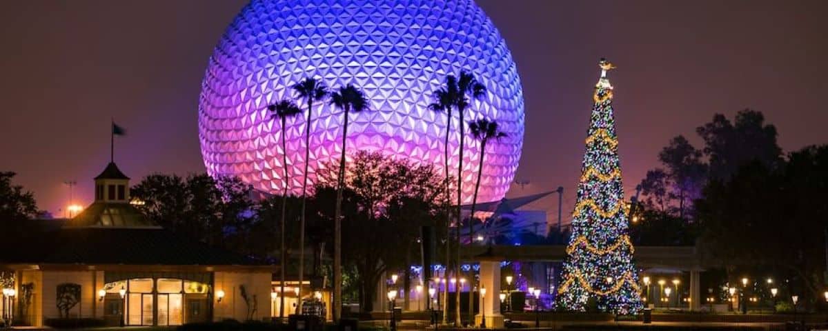 Spaceship Earth with a Christmas Tree in the foreground during the EPCOT International Festival of the Holidays