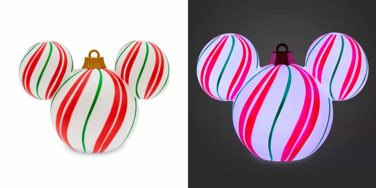 Two images showcase a holiday ornament with Disney Magic, shaped like Mickey Mouse and featuring red and green stripes. On the left, it sits against a white background; on the right, this light-up decor glows brilliantly against a dark backdrop.