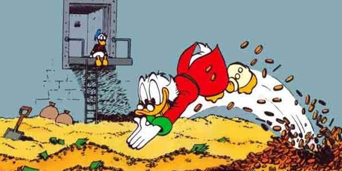 A cartoon duck in a red coat and glasses joyfully dives into a pile of gold coins and cash. Another duck watches from a platform above, sitting with a thoughtful expression. A ladder and sacks are visible beside them.