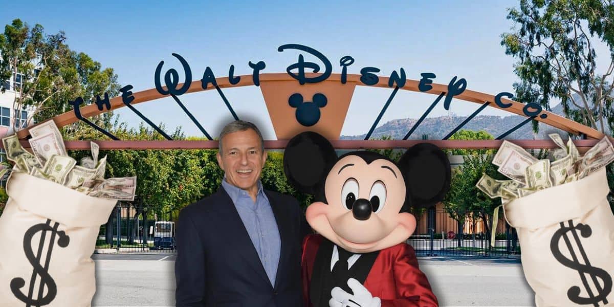 Bob Iger and Mickey Mouse with bags of cash in front of the Walt Disney Company building.