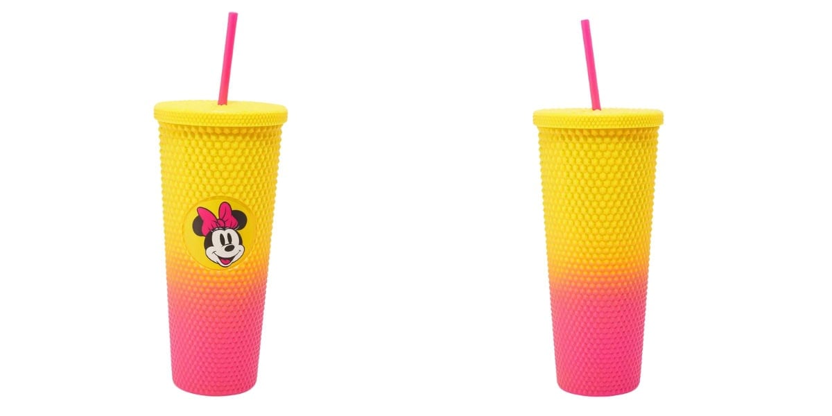 Two ombré studded tumblers with textured surfaces, transitioning from yellow to pink. Each has a pink straw and features a charming Disney cartoon character logo on its front, reminiscent of vibrant carnival cups.