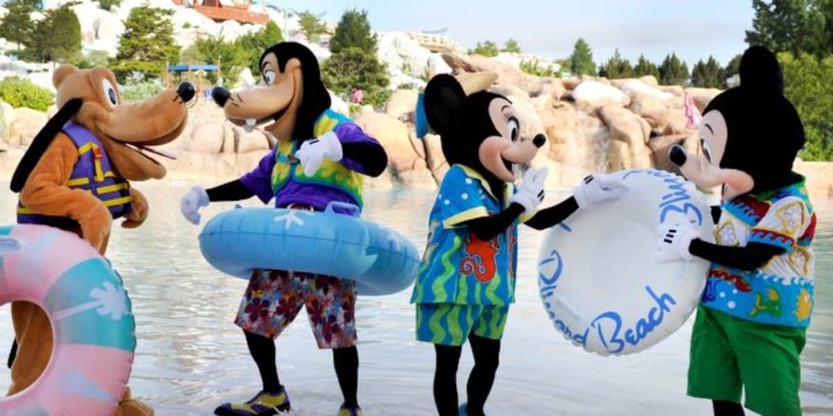 Pluto, Goofy, Minnie, and Mickey by the water at Blizzard Beach