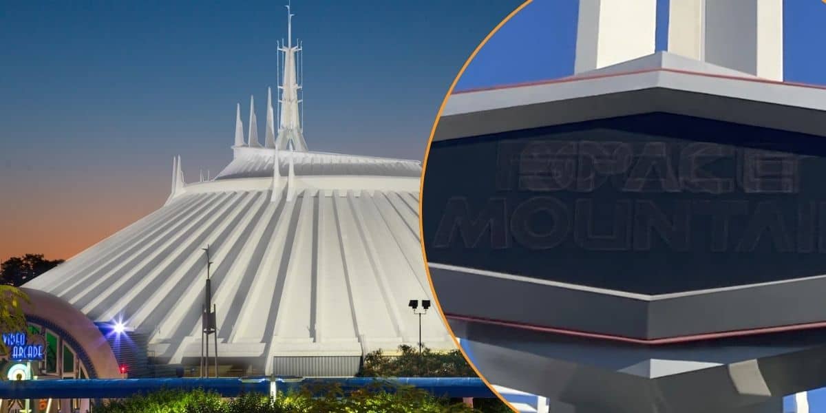 A nighttime view of Space Mountain, a famous white, dome-shaped ride with sharp, futuristic spires at Disneyland. On the right is the sign at the entrance to the roller coaster.