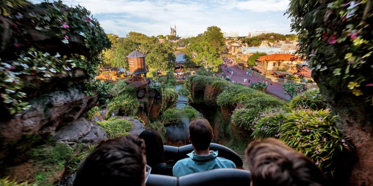 Guests descending the final drop on Tiana's Bayou Adventure.