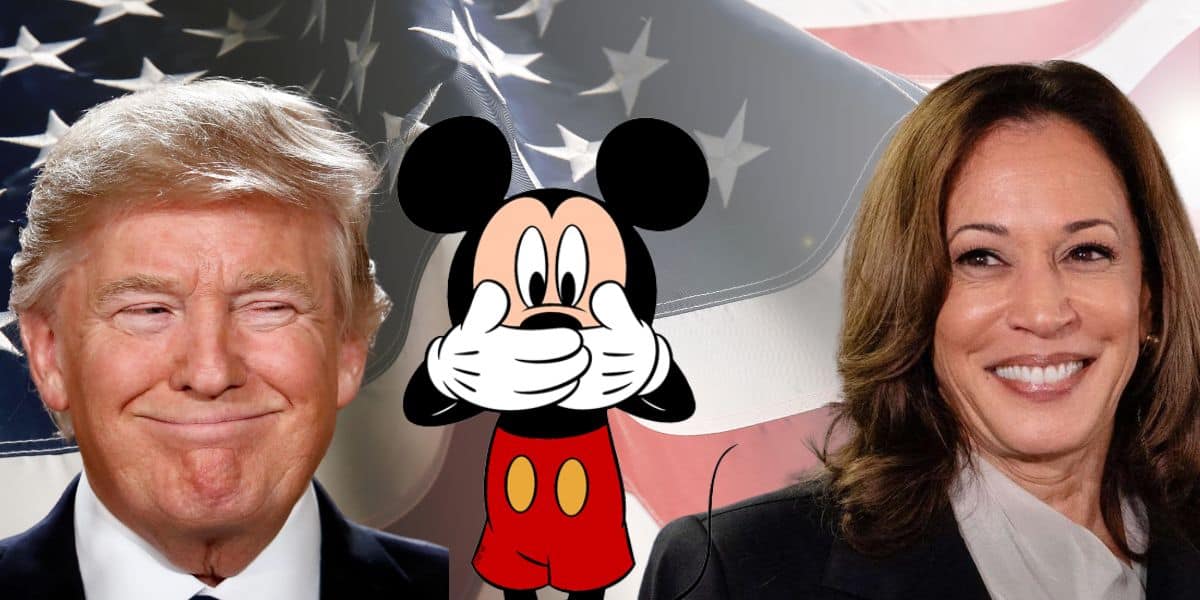 An edited image shows a cartoon character, Mickey Mouse, covering its mouth with both hands. On the left of Mickey is Donald Trump, smiling, and on the right is Kamala Harris, also smiling. They are in front of an American flag background.