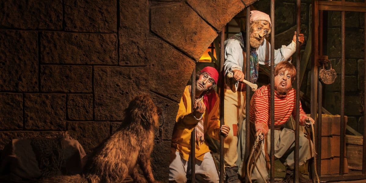 Pirates in the jail with the dog Pirates of the Caribbean Magic Kingdom Walt Disney World