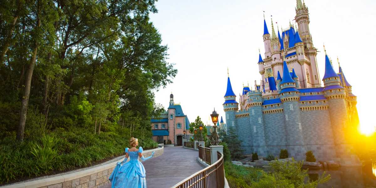 Cinderella walks toward a Cinderella Castle at Disney World