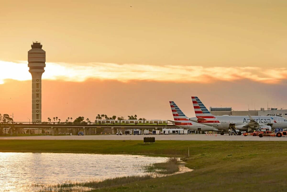 orlando international airport planes on tarmac at sunset