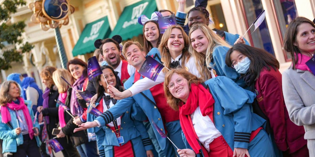 Cast Members cheer on Main Street, U.S.A. in Disneyland Paris