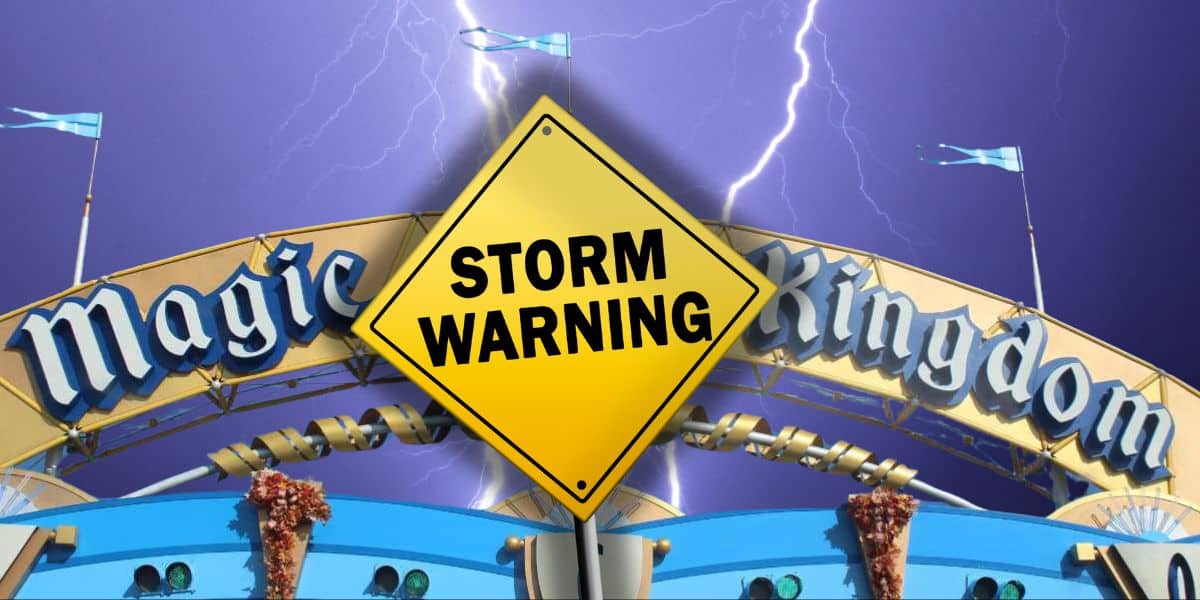 The entrance sign of Disney’s Magic Kingdom is shown with a stormy purple sky and lightning in the background. A yellow caution sign with the text "Storm Warning" is overlaid in front of the entrance.