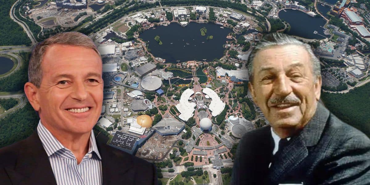 Aerial view of the Disney World theme park EPCOT with Bob Iger to the left and Walt Disney to the right in the foreground, both smiling. The park showcases various buildings, winding pathways, and a shimmering lake.