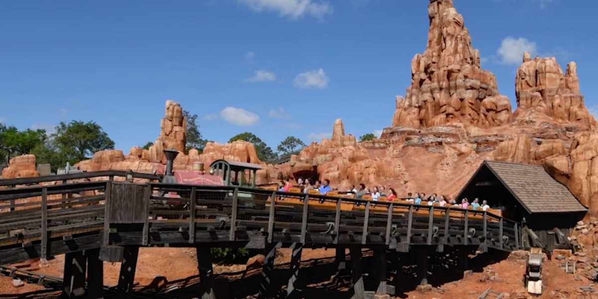 Guests riding Big Thunder Mountain Railroad at Magic Kingdom in Disney World