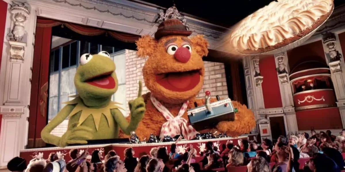 Kermit the Frog and Fozzie Bear, stars of the Muppets Show, emerge from the screen during Muppet*Vision 3D