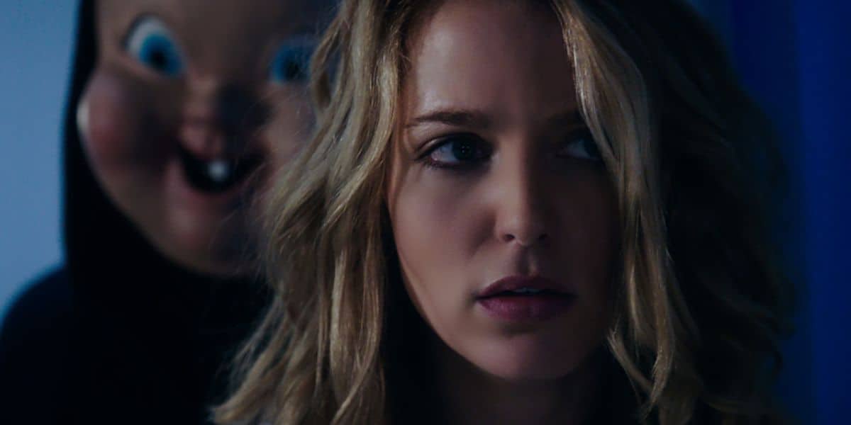 Jessica Rothe with the killer behind her in 'Happy Death Day'