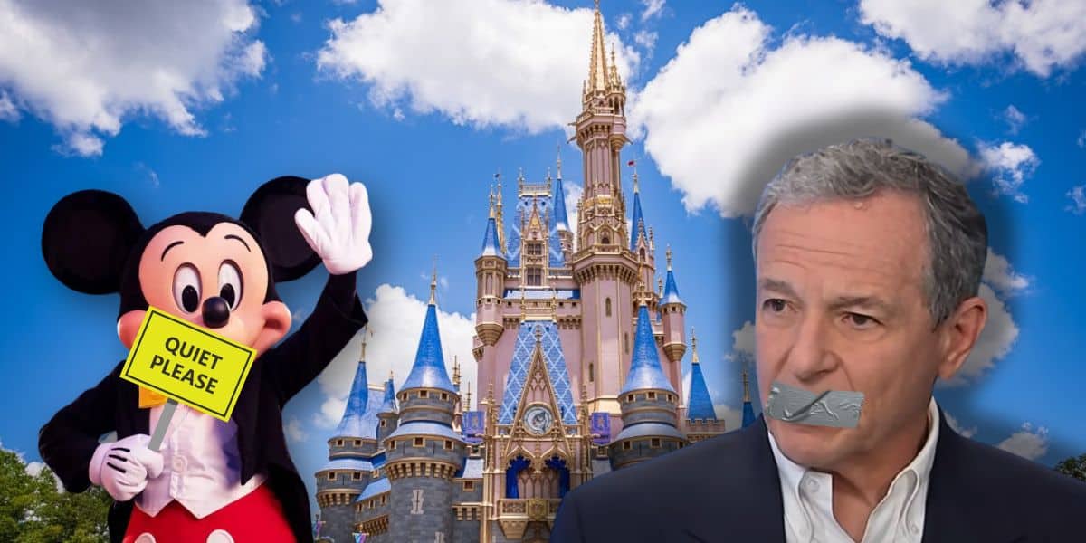 A digitally edited image showing Disney's Mickey Mouse holding a "Quiet Please" sign in front of a castle, with a man having duct tape over his mouth in the foreground. The sky is clear with some fluffy clouds. This is in relation to Disney vacation cost concerns.