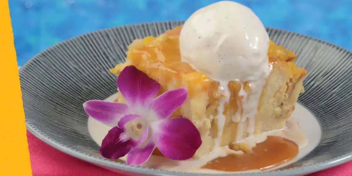 Ohana Bread Pudding on a plate with a purple flower