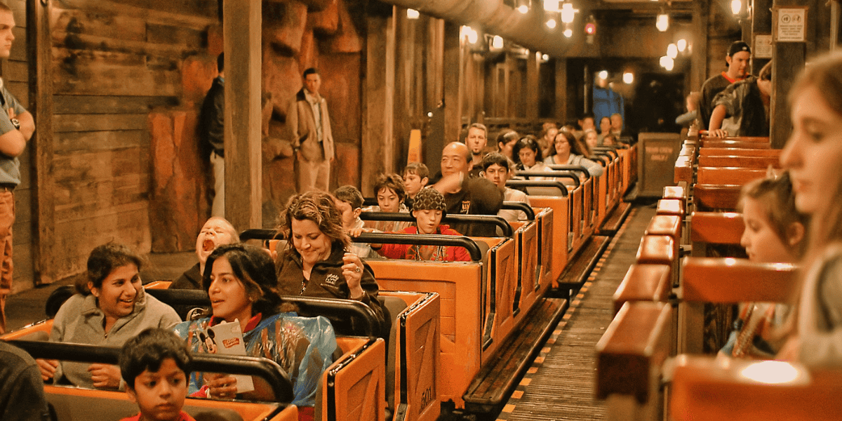 People riding big thunder mountain at Disney World