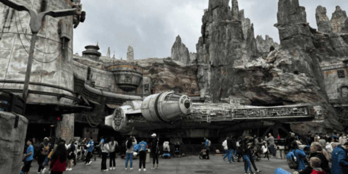 Crowds gather around the Millennium Falcon at Star Wars: Galaxy's Edge