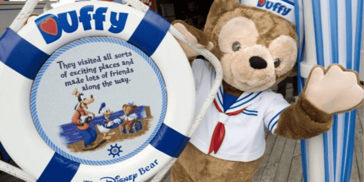 Duffy the Bear (teddy) posing at a sailor wheel