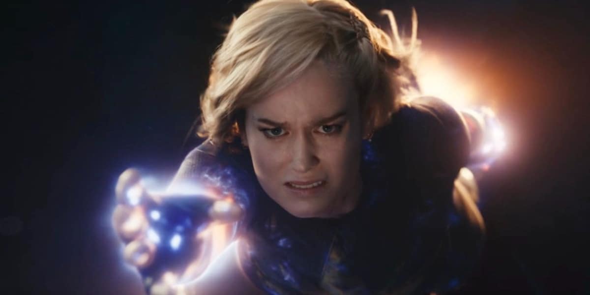 Captain Marvel (Brie Larson) flying forward, looking upset