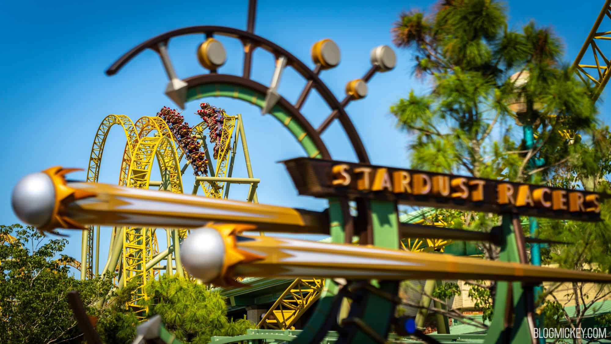 A roller coaster ride with a sign that says stardust racers