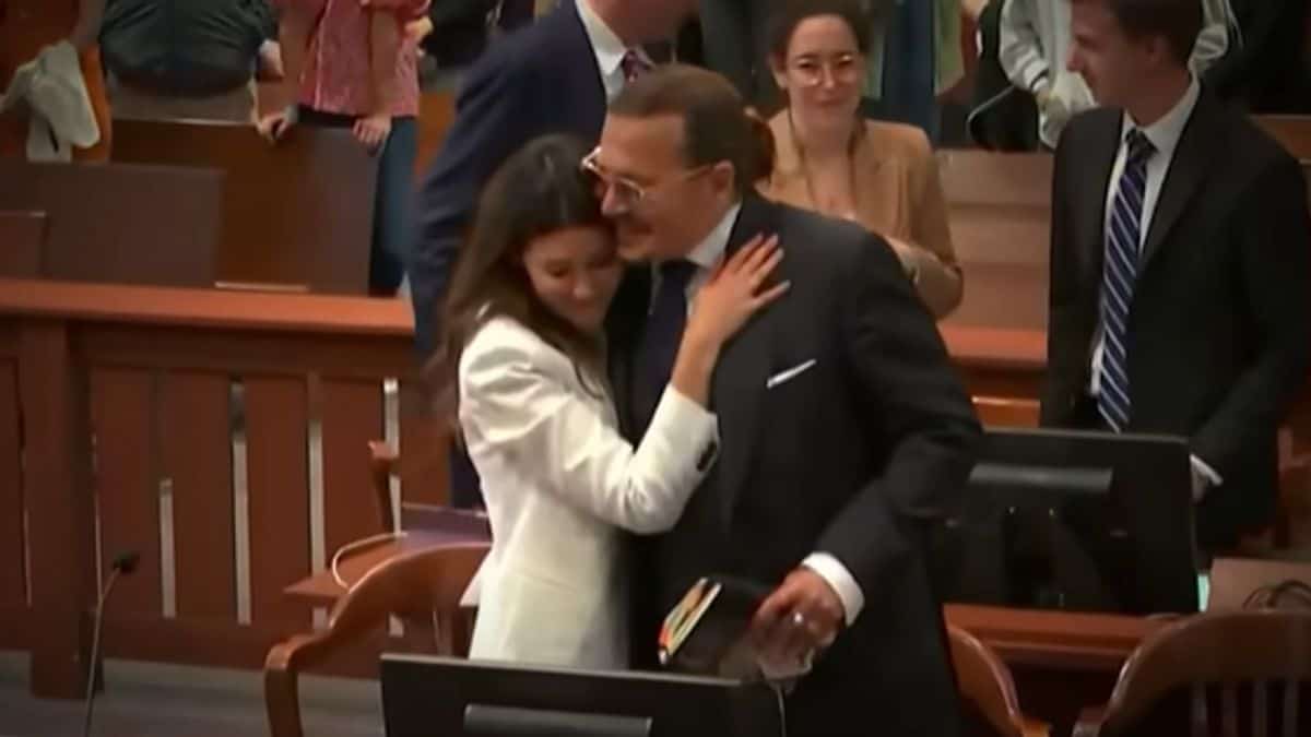 Camille Vasquez and Johnny Depp celebrate his court win