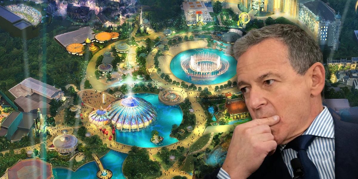 Disney CEO Bob Iger appears thoughtful in the foreground, with an aerial view of a brightly lit theme park, featuring rides, pools, and attractions, displayed in the background at Universal Orlando Resort Epic Universe begins its second wave of expansions.