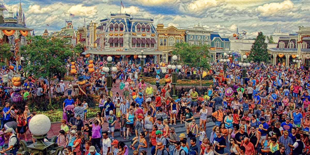 A large crowd of guests on Main Street, U.S.A. at Magic Kingdom, Walt Disney World Resort as Epic Universe opens down the street as President Trump celebrates his birthday.