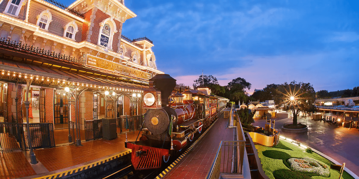 Main Street Station as the Walt Disney World Railroad pulls in, at dusk.