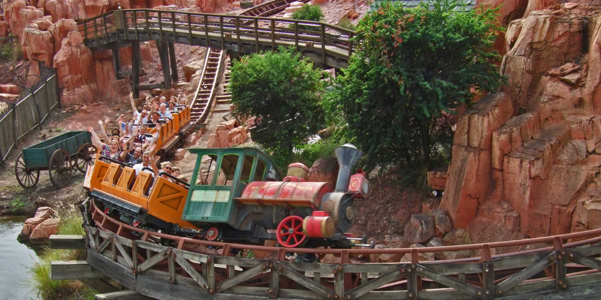 Guests riding the Magic Kingdom attraction Big Thunder Mountain in Disney World