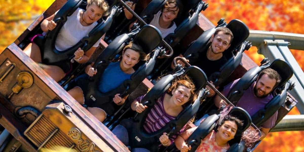 A group of guests riding a coaster at Dollywood