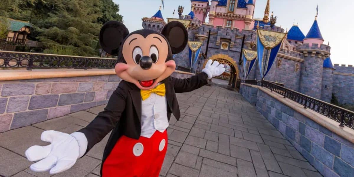 Mickey Mouse in front of Sleeping Beauty Castle