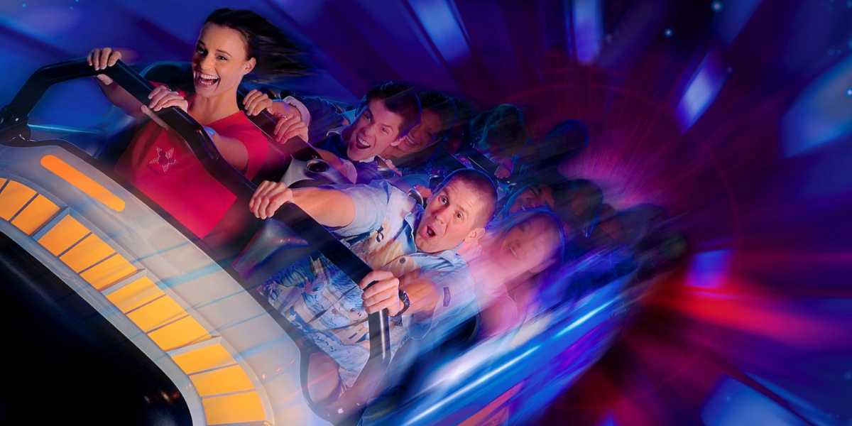 A group of people ride Space Mountain at Disneyland