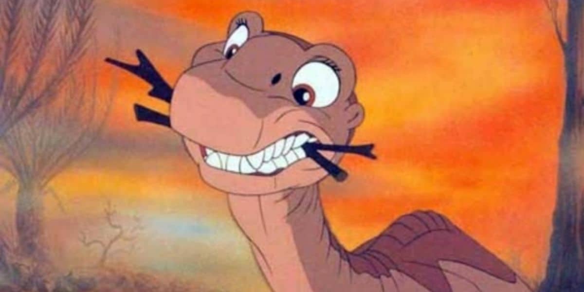 Littlefoot with sticks in his mouth in 'The Land Before Time'