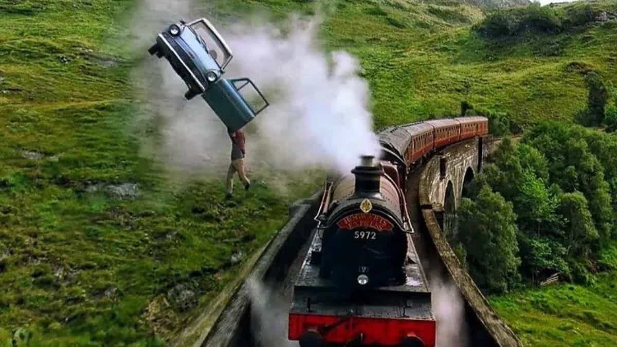 A dramatic scene in 'Harry Potter and the Chamber of Secrets' where a flying car, with its door open, soars above the Hogwarts Express crossing a lush, green hillside.