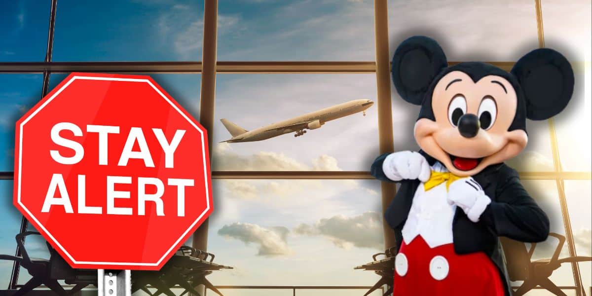 Disney locations - Mickey Mouse with a "stay alert" sign inside of an airport.