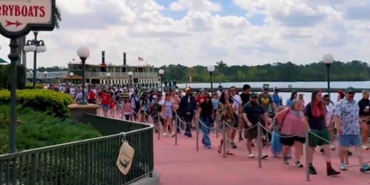 Walt Disney World Resort crowds walking toward the entrance to Magic Kingdom Park from the ferryboat.