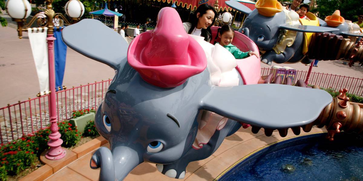 Guests ride Dumbo at Hong Kong Disneyland
