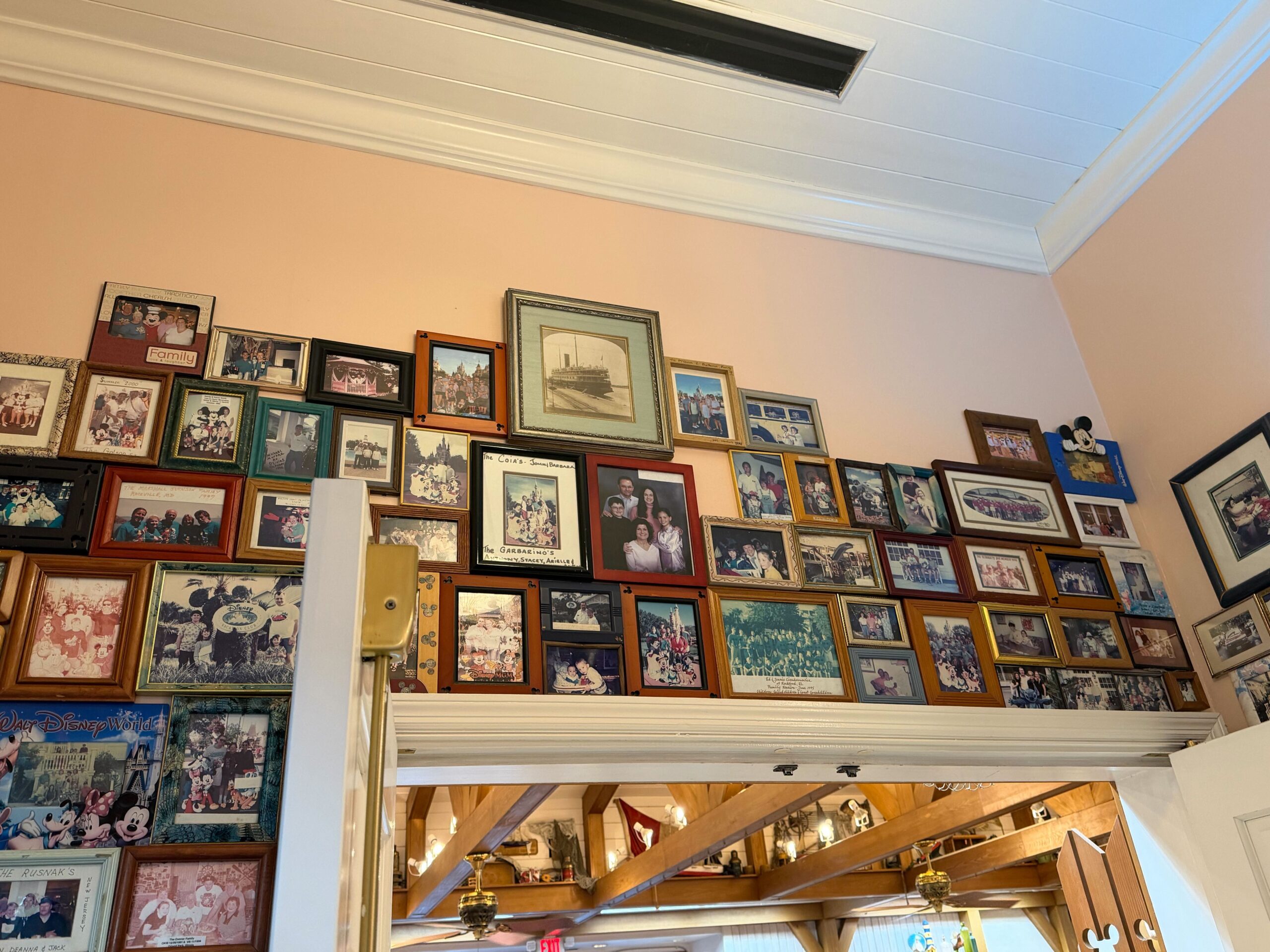The DVC photo wall at Olivia's Cafe in Disney's Old Key West Resort in Walt Disney World